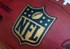 Shock Death Rocks NFL – 49ers Star GONE! Close-up of an NFL football with the logo prominently displayed