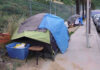 World Cup Clean-Up Sparks Liberal Fury Tents and belongings set up along sidewalk.
