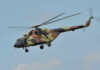 Air Force Helicopter Makes Emergency Landing in DC Camouflage military helicopter in flight against blue sky.