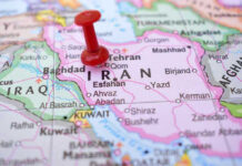 Mamdani Schedules SECRET Meeting With Iran Leaders! Red pushpin marking Iran on a map.