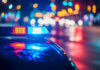 Triple Deported Illegal Murders 6-Year-Old Girl! Police car with flashing lights at night.