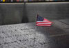 9/11 Families Revolt – Order Muslim Mayor to STAY AWAY! American flag on a rainy memorial nameplate.