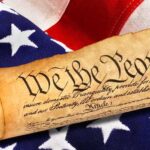 Rolled U.S. Constitution on an American flag