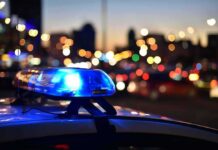 Candidate Child Predator ARRESTED – Violated Offender Registry Police car light bar flashing at dusk