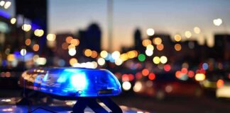 Candidate Child Predator ARRESTED – Violated Offender Registry Police car light bar flashing at dusk