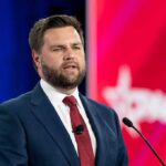 JD Vance’s 2016 Essay Destroying Trump REPUBLISHED! A man in a suit delivering a speech at a conference