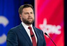JD Vance’s 2016 Essay Destroying Trump REPUBLISHED! A man in a suit delivering a speech at a conference