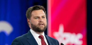 JD Vance’s 2016 Essay Destroying Trump REPUBLISHED! A man in a suit delivering a speech at a conference