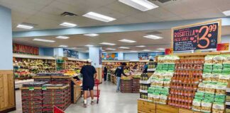 Groceries About To Cost MORE After Latest Bill Passed Interior of a grocery store with customers shopping for fresh produce