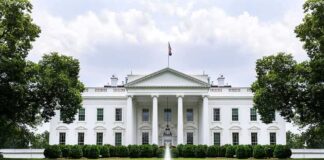 China Establishes Headquarters FEET Away From White House The White House with fountain and red flower bed