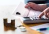 Migrants Granted College Admission Priority Over U.S Students! Hands calculating student loan with document and calculator