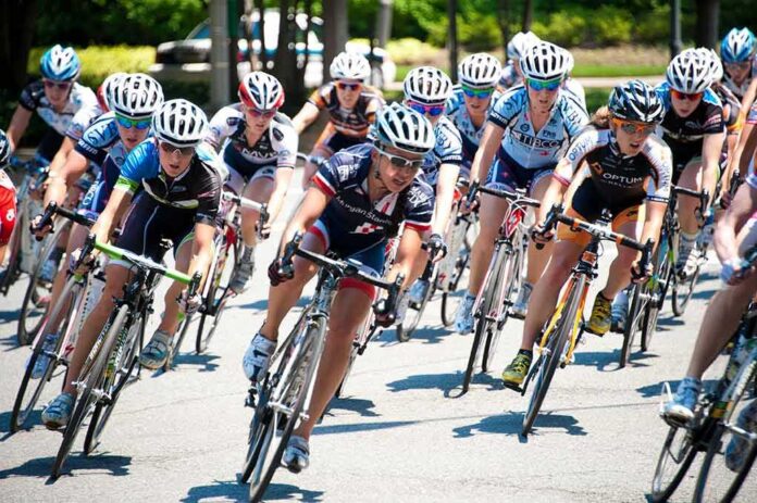 shutterstock_104846546 Cyclists racing in a tight pack on a road