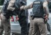 Illegal Alien Attacks Cop, Tries to Steal His Gun Police officers arresting a person beside a car