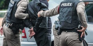 Illegal Alien Attacks Cop, Tries to Steal His Gun Police officers arresting a person beside a car