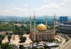 Islamic Prayer BLASTS Five Times Per Day Across U.S Cities Golden-domed mosque with four minarets in a modern cityscape