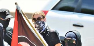 Antifa Mob ATTACKS Conservative Star in Church Masked protesters holding a black and red flag