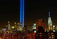 Journalists Told to Use Stunning New Term for 9/11 Terror Attack New York City skyline at night with twin blue light beams