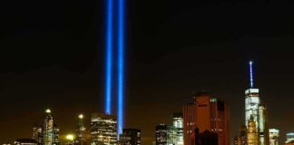 Journalists Told to Use Stunning New Term for 9/11 Terror Attack New York City skyline at night with twin blue light beams