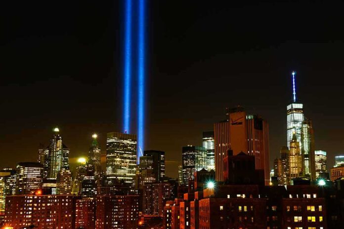 New York City skyline at night with twin blue light beams
