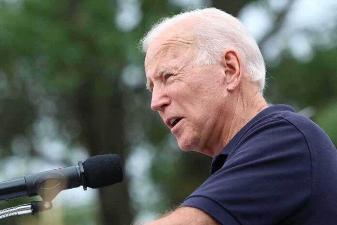 elderly man speaking into a microphone outdoors