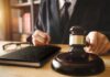 Illegal Migrant Assisting Judge Walks Scot-Free Judge with gavel striking sound block