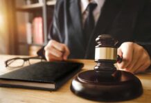 Illegal Migrant Assisting Judge Walks Scot-Free Judge with gavel striking sound block