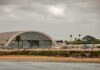 Bomb Scare ROCKS US Air Base airport hangar with helicopters near a shoreline