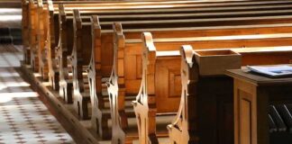 Dem Stopped Going to Church Because Republicans Were There wooden church pews in sunlight