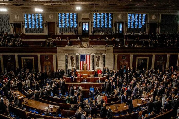 shutterstock_1186368277 U.S. House chamber with lawmakers gathered before a session