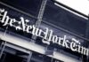 The New York Times sign on a glass building facade