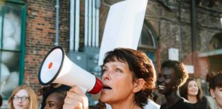 Woman with megaphone leading a protest