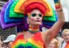 James Talarico’s OBSESSION With Drag Queens Gets Weirder Drag performer in vibrant rainbow costume at a parade