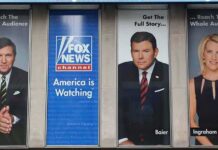 Tucker Carlson and Bret Baier on large Fox News promotional posters