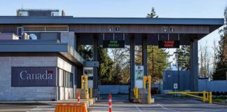 Canada border crossing booths with open and closed lane signs