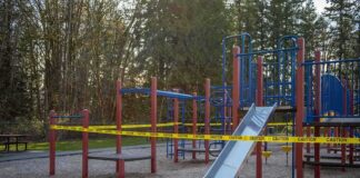 Playground equipment wrapped with caution tape