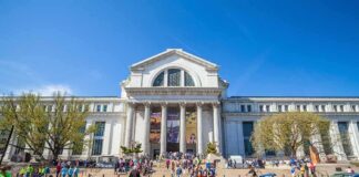 Neoclassical museum building with columns and busy entrance