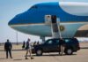 Air Force One MEdia Shake-Up Sparks Fury Security detail near blue and white aircraft with staircase and SUV
