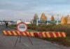 Ukraine border crossing with stop sign and barrier