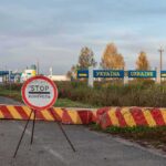 Residents On Polands Border BRACE For Russian Attack Ukraine border crossing with stop sign and barrier