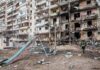 Hundreds Of Drones Blast Moscow Damaged apartment building behind a playground slide