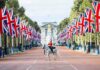 Scotland, Wales and Northern Ireland Call for Independence From UK mounted guard on white horse along flag-lined boulevard