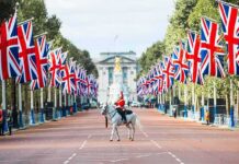 Scotland, Wales and Northern Ireland Call for Independence From UK mounted guard on white horse along flag-lined boulevard