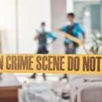Worker GUNS DOWN Senior Home – Multiple Wounded! crime scene tape in a living room with two officers in background
