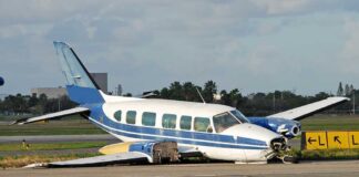 Runway Mayhem: Car Into Slams Plane Damaged blue and white small airplane on an airport runway