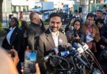 Mamdani Announces Plan to Make NYC Traffic More Congested! Zohran Mamdani speaks at a press conference; Julia Bacha is visible among the crowd