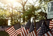 Mamdani Draws Outrage by Signing 9/11 Order American flags displayed outdoors at a memorial