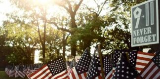 Mamdani Draws Outrage by Signing 9/11 Order American flags displayed outdoors at a memorial