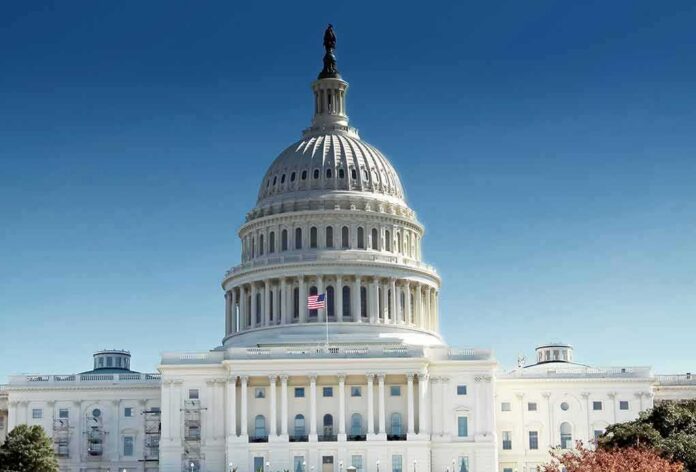 United States Capitol building with dome under clear blue sky