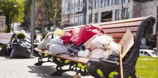 Governor Hopeful VOWS To Remove Skid Row Bulldozed Person sleeping on a park bench with belongings
