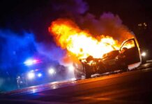 Maniac Woman Sets Man on Fire After Heated Argument Burning car on a dark street at night